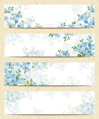 set of four vector web banners with blue forget-me-not flowers.