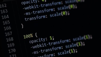 scrolling through websites' css code in a dark color-schemed editor window. cascading style sheet sc