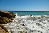 Fototapeta Morze - Waves beating against coastal rocks on the cliffs
