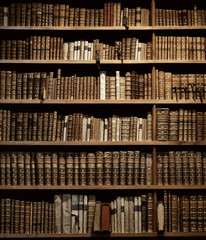 old books on wooden shelf.