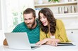 © WavebreakMediaMicro - Couple having video chat on laptop