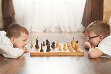 Two Boy Playing Chess, Studio, Gray Background