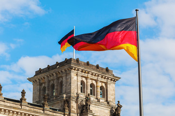 German Reichstag in Berlin, Germany, with national flags