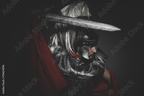 Fotografie, Obraz Praetorian Roman legionary and red cloak, armor and sword in war