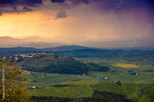 Fotografie, Obraz Tuscany valley in stormy weather at sunset, Italy