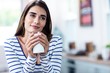 © WavebreakmediaMicro - Thoughtful young woman holding mug at home