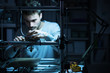 © StockPhotoPro - Young engineer working on a 3D printer