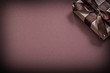 © mihalec - Wrapped gift box on brown background holidays concept