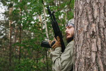 Wall Mural - Armed man in a zone of armed conflict