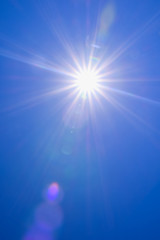 Wall Mural - real sunshine flare in blue sky