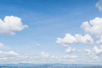 Wall Mural - fantastic soft white clouds against blue sky