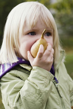A Girl Eating A Pear, Nacka, Sweden.