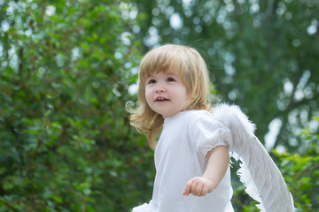 Wall Mural - Little boy dressed as angel