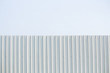 White zinc fence isolated on sky background with copy space