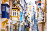 Fototapeta Uliczki - Typical narrow streets with colorful balconies in Valletta , Malta