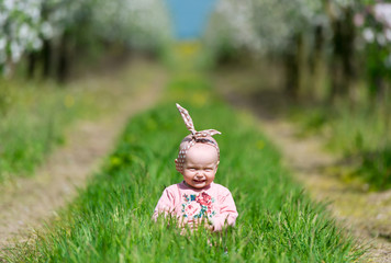 The kid in a green grass.