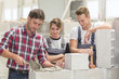 © Atelier 211 - young apprentice with buider professional