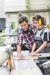 © Atelier 211 - young apprentice with professional carpenter
