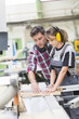 © Atelier 211 - young apprentice with professional carpenter