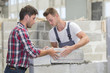 © Atelier 211 - young apprentice with builder professional