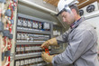 © Atelier 211 - electrician at work
