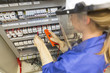 © Atelier 211 - young electrician woman at work