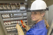 © Atelier 211 - young electrician woman at work