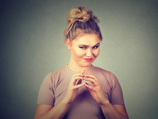 Sneaky, sly, scheming young woman plotting something. Negative human emotions, facial expressions