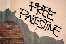 Handwritten Graffiti Free Palestine Sprayed On Wall, Anarchist Aesthetics. Expression Of Solidarity With Palestinian People To Escape Inferiority And Establish Own Independent State 
