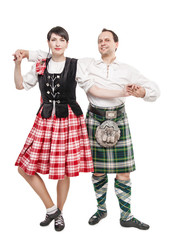 Wall Mural - The pair woman and man dancing Scottish dance