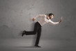 © ra2 studio - Running businessman with device in hand