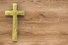 Gold Cross On Wooden Background