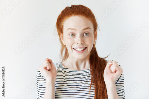 Close Up Isolated Portrait Of Cheerful Young Redhead Woman Looking And
