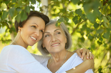 Poster - senior Mother and daughter in  park