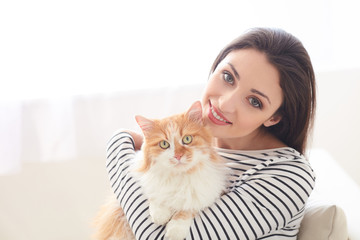 Pretty young woman is resting with animal