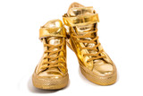 Fototapeta Tulipany - Pair of golden sneakers isolated