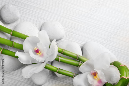 Obraz w ramie Beautiful spa composition with bamboo on light wooden background