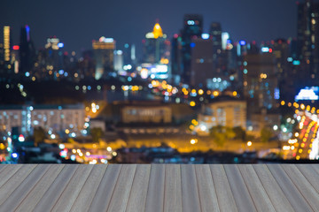 Wall Mural - Opening wooden floor, Abstract blurred bokeh lights, central business downtown background