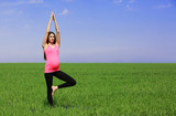 Fototapeta Las - Pregnant woman practicing yoga pose