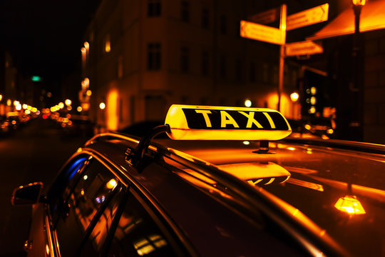 taxi sign on the roof of a taxi