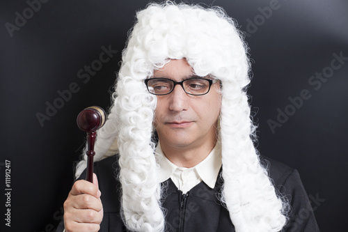 Fotografie, Tablou Portrait Of Male Lawyer with eyeglasses Holding Judge Gavel