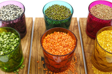 Wall Mural - Multicolored clear glasses with various legumes ( green peas, re