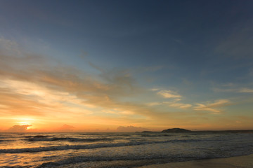 Wall Mural - sunset dramatic sky with colorful cloud on sea