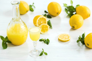 Italian traditional liqueur limoncello with lemon