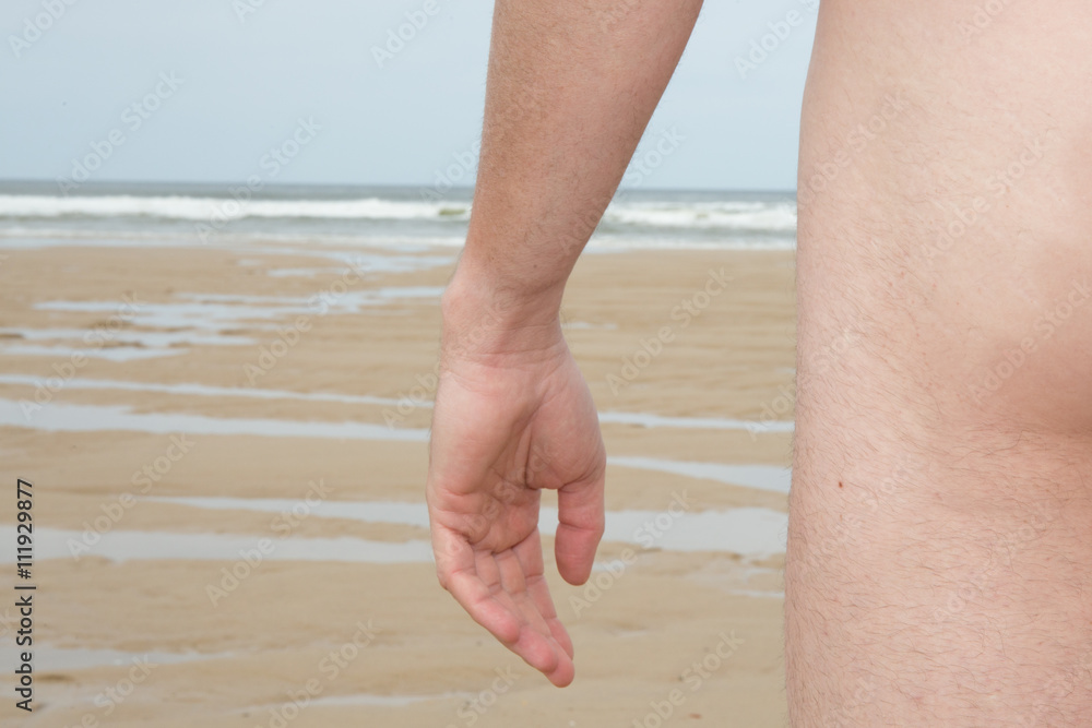 naturist Man naturist on beach under deep blue sky の Stock フォト | Adobe Stock