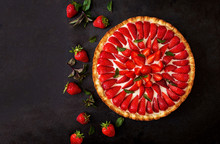 Tart With Strawberries And Whipped Cream Decorated With Mint Leaves. Top View