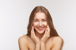© Svyatoslav Lypynskyy - Closeup portrait of happy smiling beautiful shirtless lady posing for photographer over white background. Pretty woman touching her face skin with both hands.