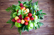 Bouquet From Fruit And Berries. Composition On A Wooden Background