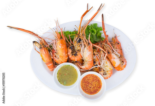 Poster Grilled shrimps on a plate served with spicy sauce