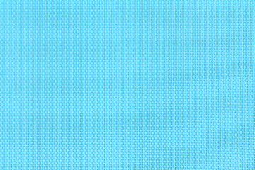 Abstract background texture of blue fishnet cloth material. Blue nylon texture for background and design with copy space for text or image.